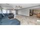 Expansive living area with tile flooring, recessed lighting, and large windows offering views of the outdoor spaces at 4813 W Belmont Ave, Glendale, AZ 85301