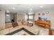 Spacious living room with tile flooring, a large couch, and an open layout perfect for entertaining guests at 4813 W Belmont Ave, Glendale, AZ 85301