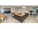 Bright and airy living area featuring tile flooring, an open layout, and plenty of natural light from various entryways at 4813 W Belmont Ave, Glendale, AZ 85301