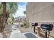 Exterior community BBQ area featuring well-maintained grills and a concrete walkway at 4850 E Desert Cove Ave # 240, Scottsdale, AZ 85254