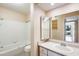 Bathroom featuring a tiled shower and tub combo, vanity and medicine cabinet at 4850 E Desert Cove Ave # 240, Scottsdale, AZ 85254