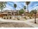 Relaxing community pool area surrounded by palm trees and well-maintained landscaping at 4850 E Desert Cove Ave # 240, Scottsdale, AZ 85254