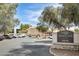 Community sign for The Village at Stone Creek Condominiums near parking area at 4850 E Desert Cove Ave # 240, Scottsdale, AZ 85254