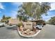Community sign for The Village at Stone Creek Condominiums with parking and covered parking at 4850 E Desert Cove Ave # 240, Scottsdale, AZ 85254