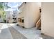 Exterior view showcasing the building's architecture with gravel landscaping and walkways at 4850 E Desert Cove Ave # 240, Scottsdale, AZ 85254