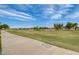 Scenic view of the lush green golf course and walking path at 4850 E Desert Cove Ave # 240, Scottsdale, AZ 85254