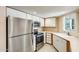 Bright kitchen featuring white cabinets and countertops, stainless steel appliances and recessed lighting at 4850 E Desert Cove Ave # 240, Scottsdale, AZ 85254