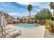 A community pool area with chaise lounges, lush greenery, and comfortable lounging areas at 4850 E Desert Cove Ave # 240, Scottsdale, AZ 85254