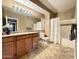 Bathroom features a large vanity, tile floors, a tub with shower, and great lighting at 5335 E Shea Blvd # 2045, Scottsdale, AZ 85254