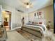 Bedroom features a king sized bed, neutral walls, and en suite bathroom with walk-in closet at 5335 E Shea Blvd # 2045, Scottsdale, AZ 85254
