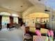 Spacious clubhouse featuring a sitting area, dining table, and open access to bar seating at 5335 E Shea Blvd # 2045, Scottsdale, AZ 85254