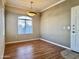 Bright dining room featuring hardwood floors, a window, and neutral walls at 5335 E Shea Blvd # 2045, Scottsdale, AZ 85254