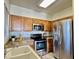 Bright kitchen showcasing stainless steel appliances, tile floors, and a well-lit countertop space at 5335 E Shea Blvd # 2045, Scottsdale, AZ 85254