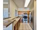 Well-lit kitchen featuring stainless steel appliances, light countertops, tile floors, and ample cabinet space at 5335 E Shea Blvd # 2045, Scottsdale, AZ 85254