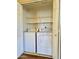 Laundry closet featuring a washer, dryer, and wire rack shelving for organization at 5335 E Shea Blvd # 2045, Scottsdale, AZ 85254