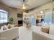 Spacious living room features wood floors, gas fireplace, open to the kitchen and dining areas at 5335 E Shea Blvd # 2045, Scottsdale, AZ 85254