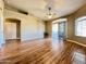 Open living room with hardwood floors, a sliding glass door, and lots of space at 5335 E Shea Blvd # 2045, Scottsdale, AZ 85254