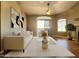 Comfortable living room features a cozy chair, modern sofa, and sliding glass door to the patio at 5335 E Shea Blvd # 2045, Scottsdale, AZ 85254