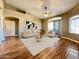 Bright living room boasts neutral furniture, wood floors and sliding glass door for lots of natural light at 5335 E Shea Blvd # 2045, Scottsdale, AZ 85254