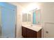 Bathroom featuring a glass enclosed shower, vanity and large mirror at 5628 S 21St Pl, Phoenix, AZ 85040