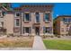 Charming home featuring symmetrical facade with dark shutters and a small balcony above the entry door at 5628 S 21St Pl, Phoenix, AZ 85040