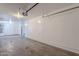 Unfinished garage with a concrete floor and ample parking or storage space at 5628 S 21St Pl, Phoenix, AZ 85040