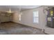 Spacious, unfinished garage area with a water heater and ample room for parking and storage at 5628 S 21St Pl, Phoenix, AZ 85040