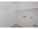 Clean, unfinished laundry room with tile flooring, utility hook ups, and a shelf at 5628 S 21St Pl, Phoenix, AZ 85040