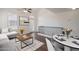 Bright open living area with high ceilings and hardwood floors adjacent to dining space at 5628 S 21St Pl, Phoenix, AZ 85040