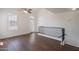 Bright open living area with high ceilings, hardwood floors, and a large window at 5628 S 21St Pl, Phoenix, AZ 85040