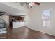 Open-concept space featuring a kitchen, living area, hardwood floors and a spiral staircase at 5628 S 21St Pl, Phoenix, AZ 85040