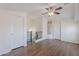 Spacious loft with hardwood floors, a ceiling fan, and a view of the staircase at 5628 S 21St Pl, Phoenix, AZ 85040