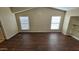 Upstairs loft with two windows providing natural light, with wood laminate flooring at 5628 S 21St Pl, Phoenix, AZ 85040