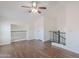 Hardwood floored loft featuring black iron stair railing and ample natural light at 5628 S 21St Pl, Phoenix, AZ 85040