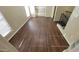 Bright loft area with gleaming wood floors, lots of natural light, and wrought iron bannister at 5628 S 21St Pl, Phoenix, AZ 85040