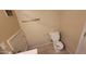Upstairs toilet and washroom, featuring tile flooring and minimal decor at 5628 S 21St Pl, Phoenix, AZ 85040