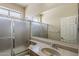 Bathroom vanity with granite countertop and shower with glass doors and chrome fixtures at 5926 W Questa Dr, Glendale, AZ 85310