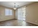 Light-filled dining area features tile flooring and a sliding glass door leading to the backyard at 5926 W Questa Dr, Glendale, AZ 85310