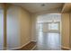 Inviting hallway with tile flooring, archway to living area, creating a warm and welcoming ambiance at 5926 W Questa Dr, Glendale, AZ 85310
