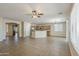 Expansive living room boasts tile flooring, seamlessly connected to the kitchen, perfect for entertaining at 5926 W Questa Dr, Glendale, AZ 85310