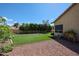 A well-manicured backyard features artificial turf, mature trees, gravel landscaping and providing a serene outdoor retreat at 6135 E Aire Libre Ln, Scottsdale, AZ 85254