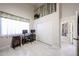 Bright room features a loft space, closet, desk, and tile floors at 6135 E Aire Libre Ln, Scottsdale, AZ 85254
