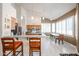Open kitchen featuring a breakfast bar, stainless steel appliances, ample counter space, and a dining area at 6135 E Aire Libre Ln, Scottsdale, AZ 85254