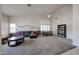 Open living room with a large couch, high ceilings, a ceiling fan and lots of natural light at 6135 E Aire Libre Ln, Scottsdale, AZ 85254