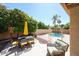 Relax and unwind on this charming patio with outdoor seating, complemented by lush greenery and a sparkling pool at 6135 E Aire Libre Ln, Scottsdale, AZ 85254