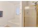 Bathroom featuring a separate tub and shower with gold trim at 648 W Cobblestone Dr, Casa Grande, AZ 85122