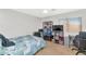 Bedroom with a large window, ceiling fan, and carpeting at 648 W Cobblestone Dr, Casa Grande, AZ 85122