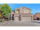 Charming two-story home featuring a three car garage and well-maintained landscaping at 648 W Cobblestone Dr, Casa Grande, AZ 85122