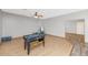 Spacious game room with hardwood floors and great natural light at 648 W Cobblestone Dr, Casa Grande, AZ 85122