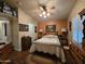 Comfortable bedroom featuring a ceiling fan, shutters and warm wall colors at 650 N Hawes Rd # 4123, Mesa, AZ 85207